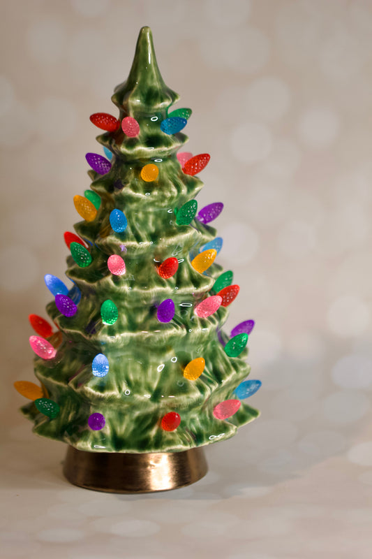 Duncan-1966-ceramic-christmas-tree-green-multicolored-lights 9 inch, fully LED lit, hand glazed, made to be an heirloom centerpeice for years of holidays to come
