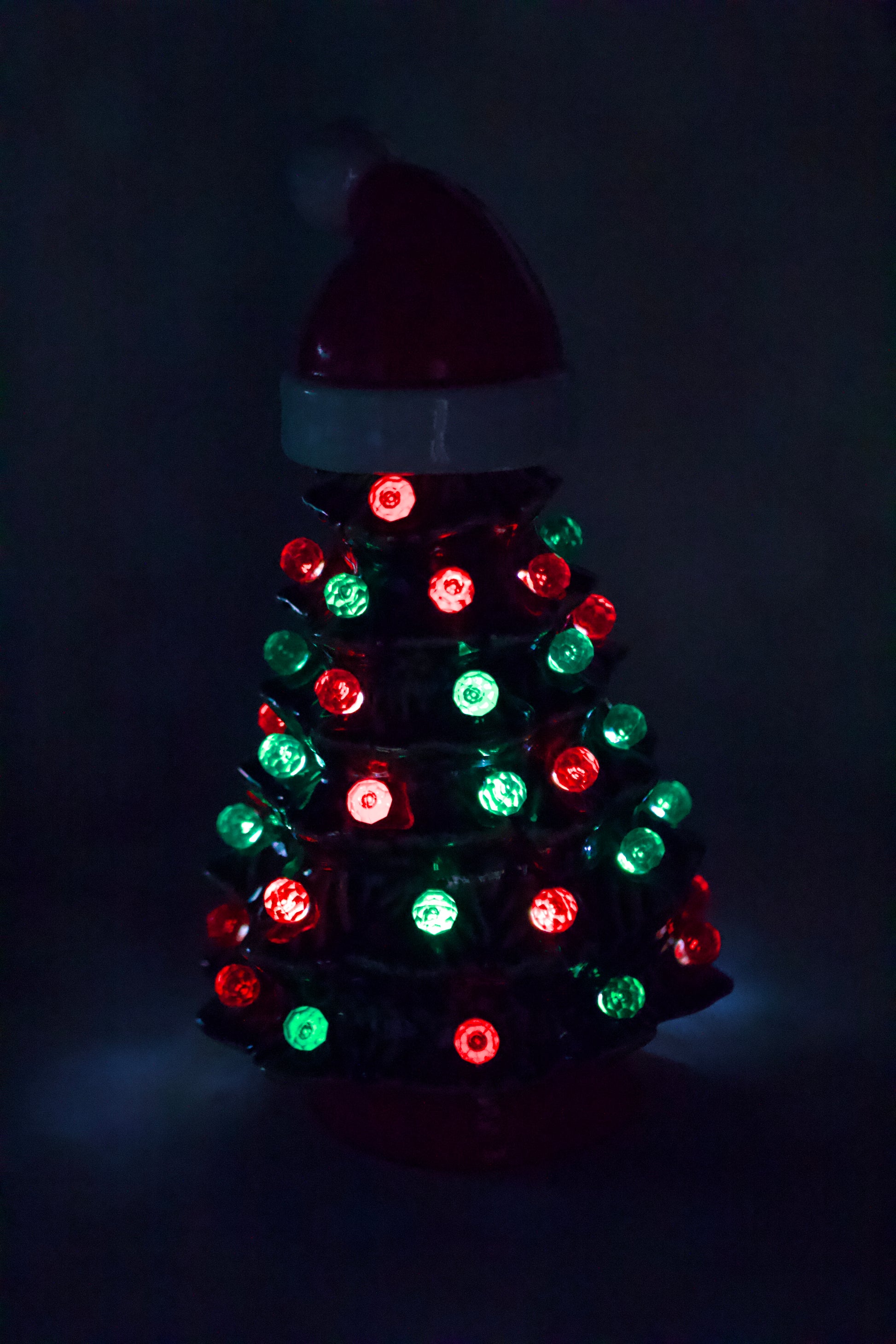 Vintage ceramic Christmas tree from a 1966 Duncan mold with Santa hat, green glaze, red and green lights, and handcrafted heirloom design