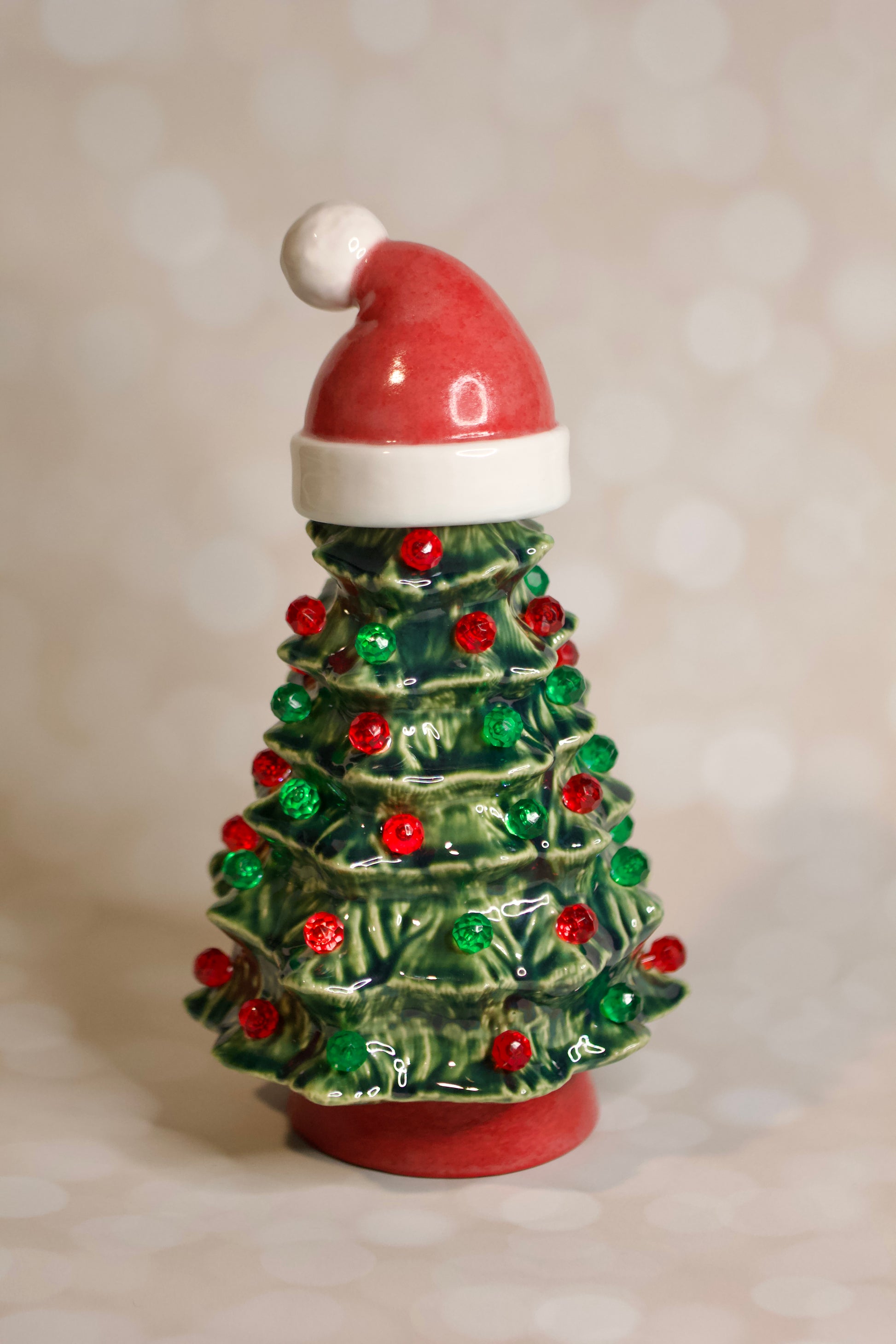 Vintage ceramic Christmas tree from a 1966 Duncan mold with Santa hat, green glaze, red and green lights, and handcrafted heirloom design