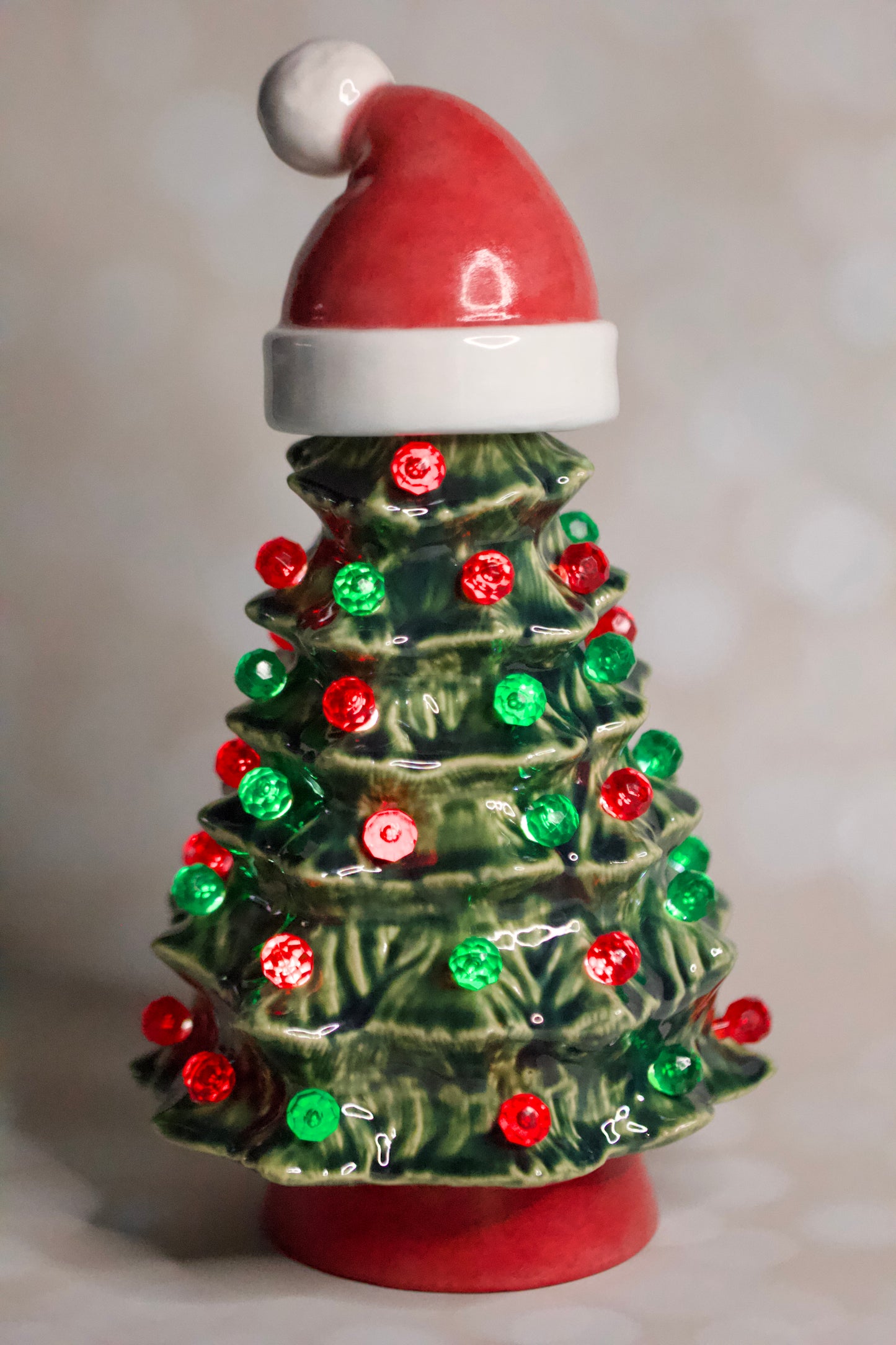 Vintage ceramic Christmas tree from a 1966 Duncan mold with Santa hat, green glaze, red and green lights, and handcrafted heirloom design