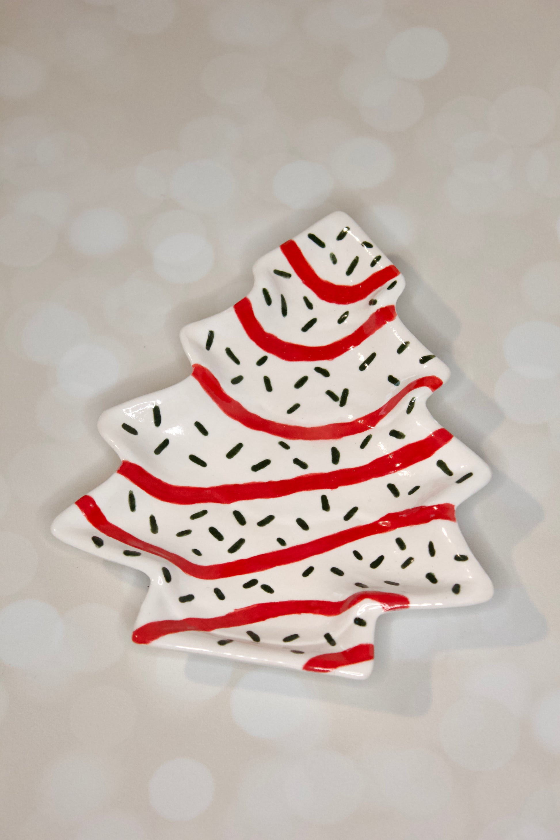 Handmade ceramic Christmas tree dessert plate inspired by Little Debbie  Christmas Tree cakes, white glaze with red and green details. Cookies for Santa.