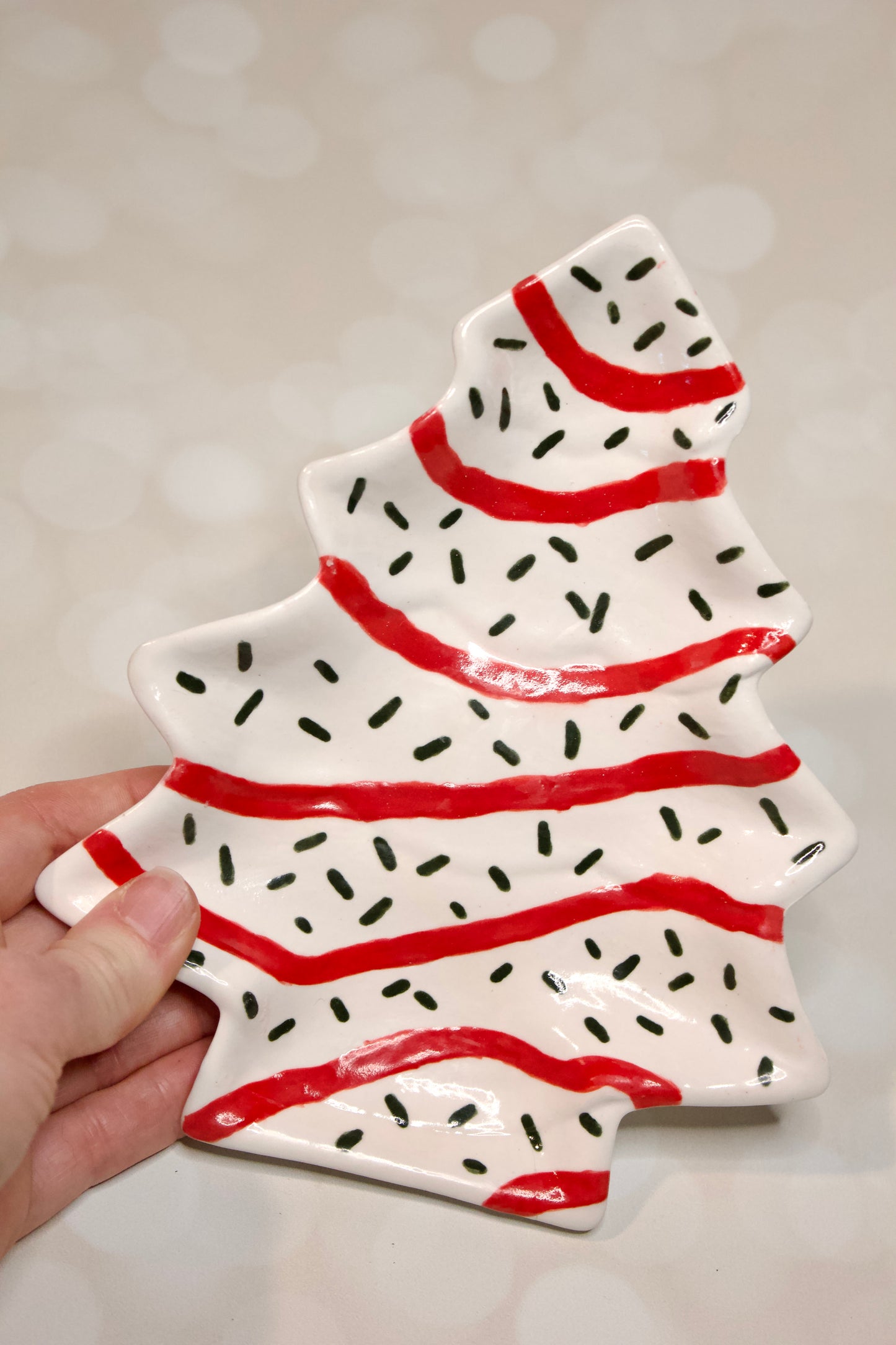 Handmade ceramic Christmas tree dessert plate inspired by Little Debbie  Christmas Tree cakes, white glaze with red and green details. Cookies for Santa
