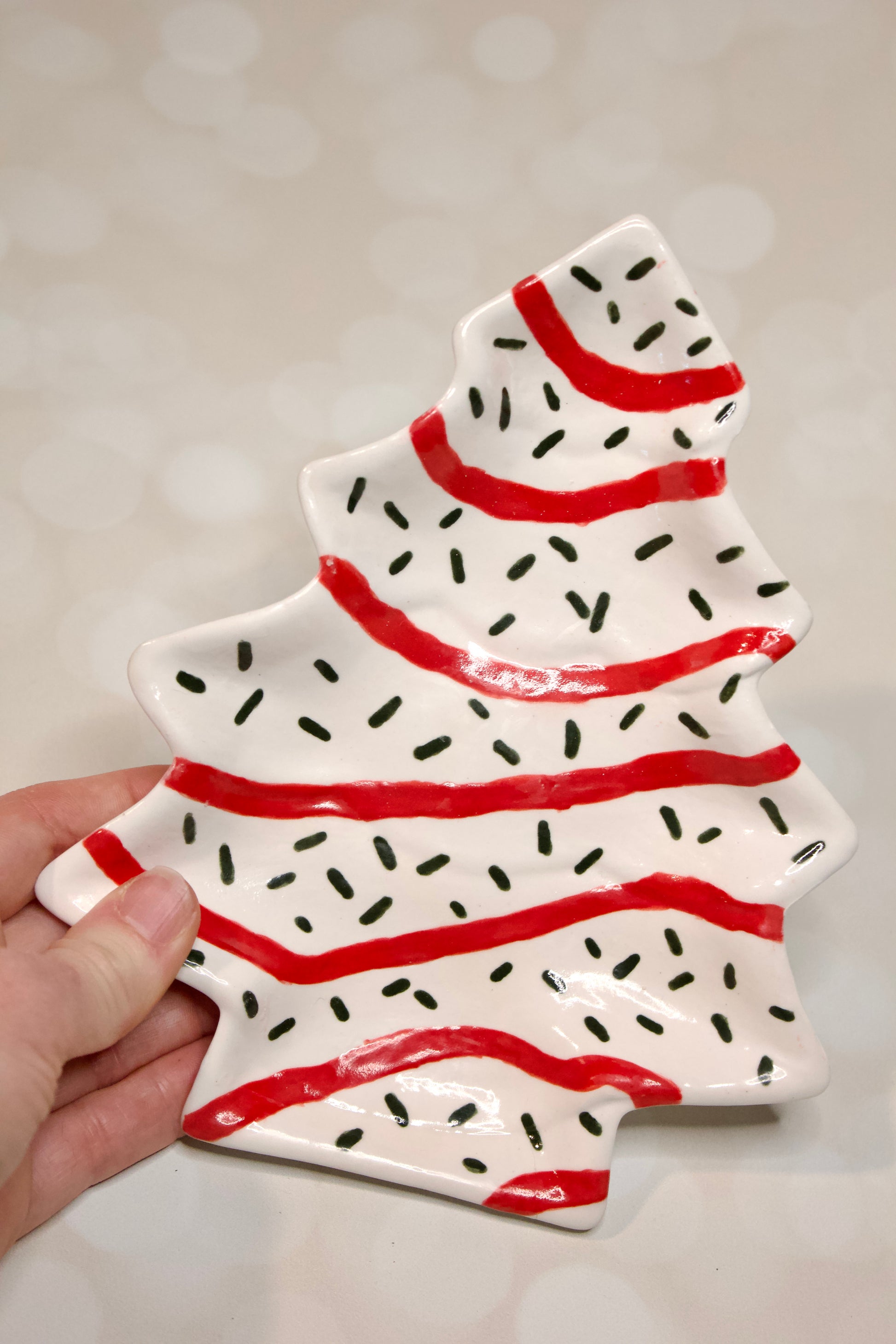 Handmade ceramic Christmas tree dessert plate inspired by Little Debbie  Christmas Tree cakes, white glaze with red and green details. Cookies for Santa