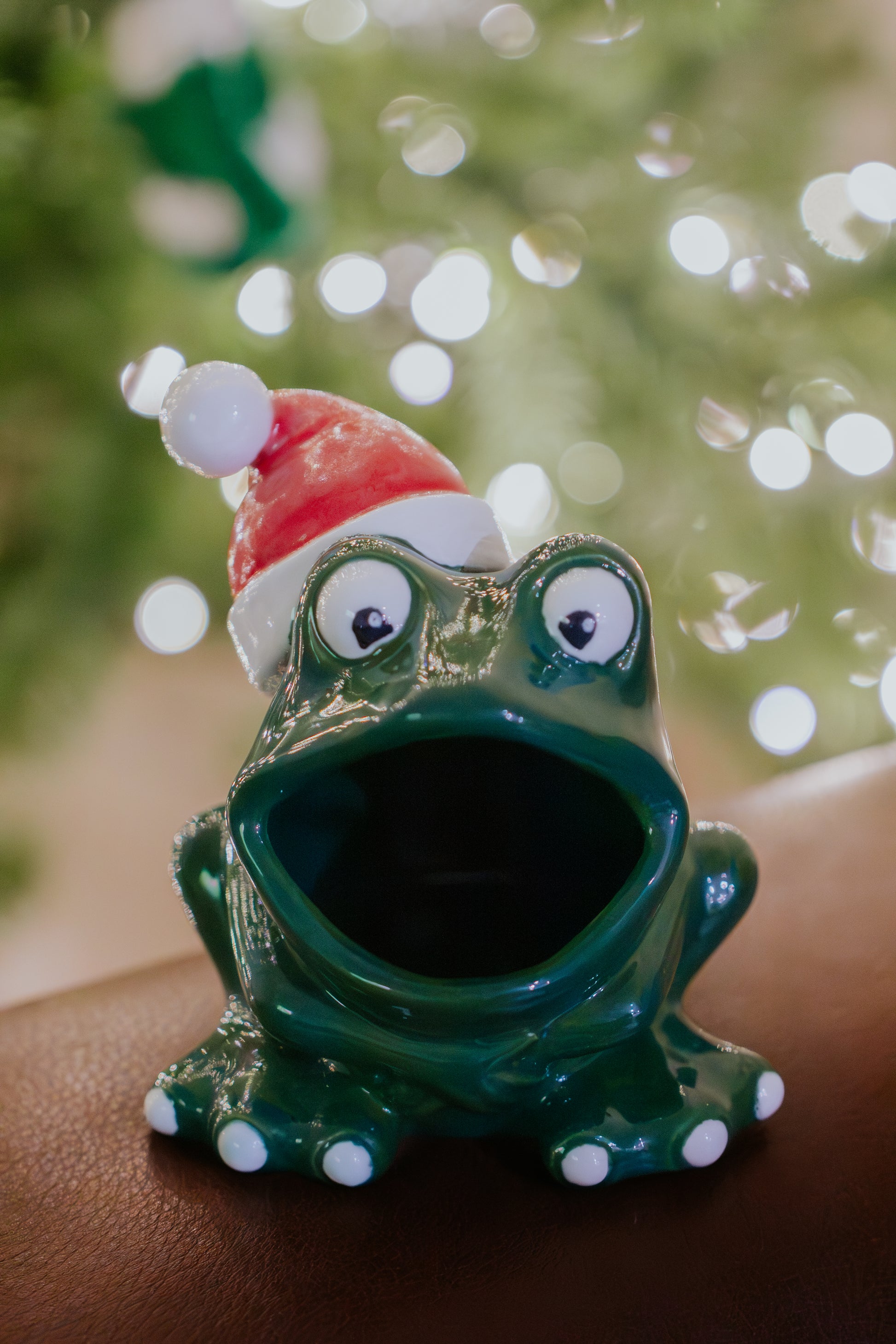 Vintage Arnel ceramic frog, limited Christmas edition with red and white Santa hat, cast from mold 774, featuring a mother-of-pearl Santa hat and festive holiday design.