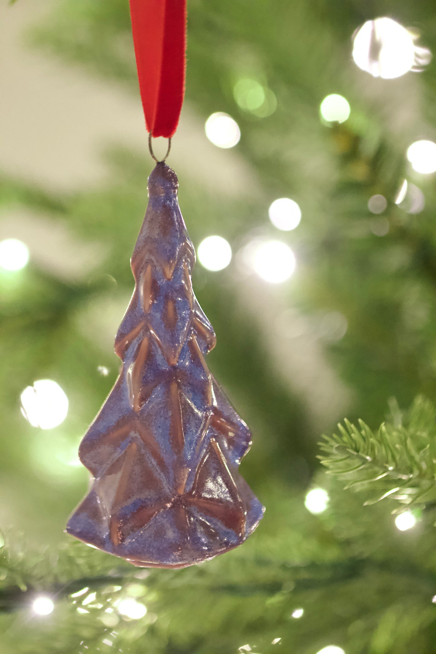 fire and ice colored faceted tree ornament ceramic hanging on christmas tree