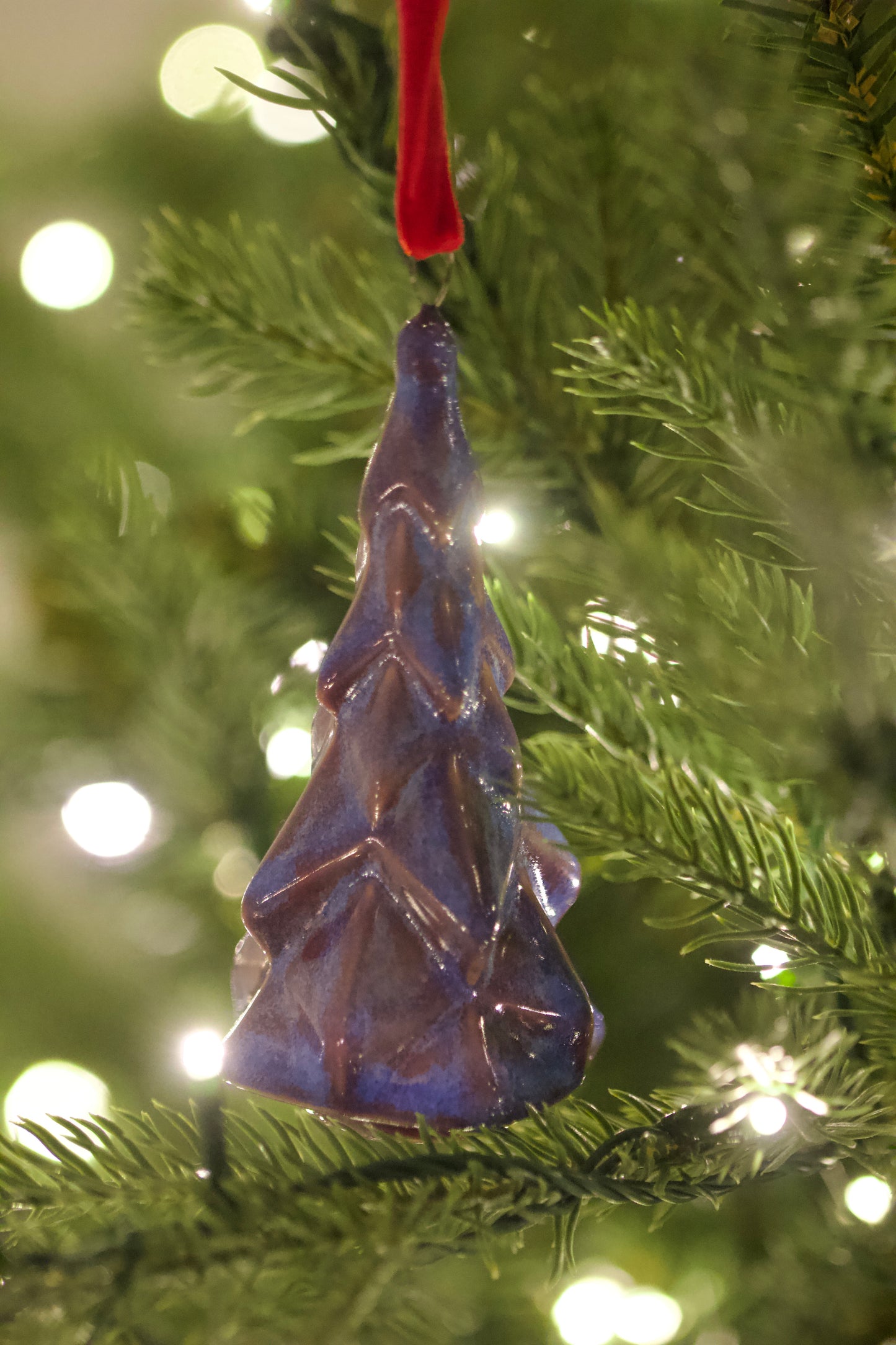 fire and ice colored faceted tree ornament ceramic hanging on christmas tree